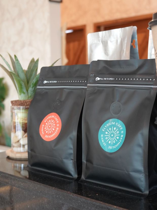 Bags of Elysium coffee on the counter